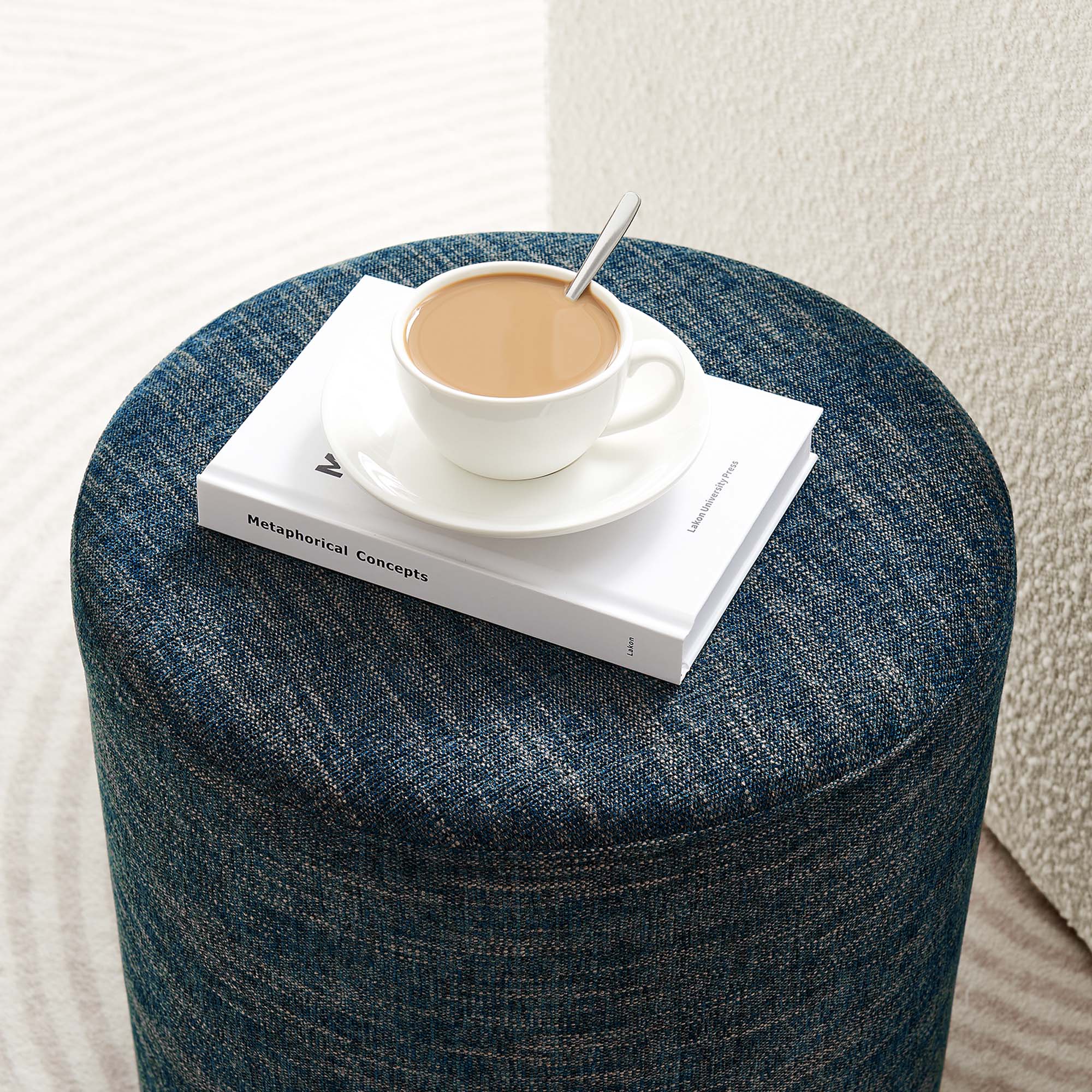 Callum 16" Round Woven Heathered Fabric Upholstered Ottoman in Heathered Weave