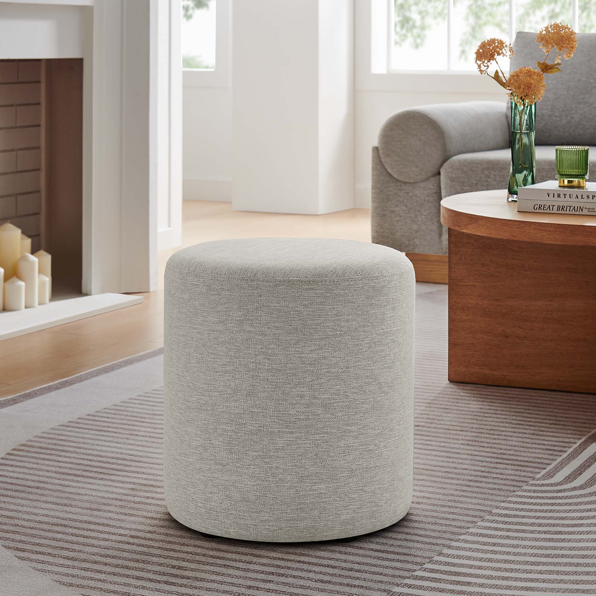 Callum 16" Round Woven Heathered Fabric Upholstered Ottoman in Heathered Weave