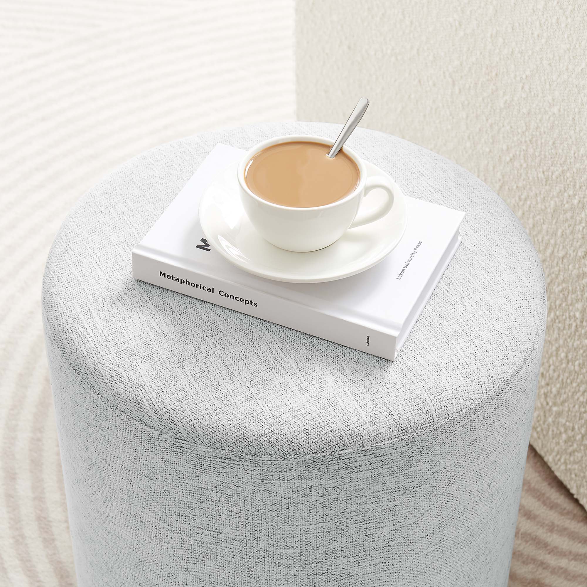 Callum 16" Round Woven Heathered Fabric Upholstered Ottoman in Heathered Weave